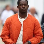 f1-movie-damson-idris-orange-jacket.webp